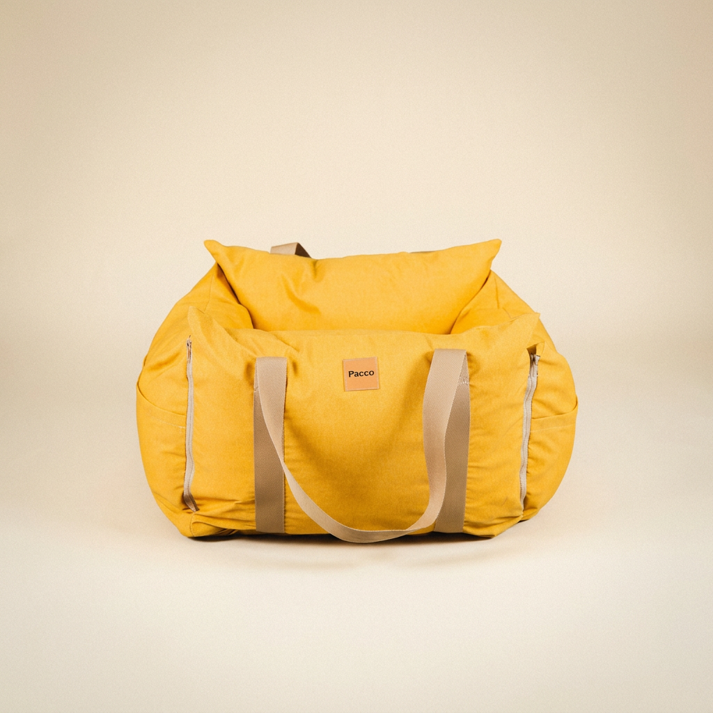 Bolsa de Transporte Cangú Explora Amarelo Solar vista de frente, com as alças no tom do produto e os zíperes laterais
